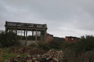 A ruined building with a few rubble
Description automatically generated with medium confidence